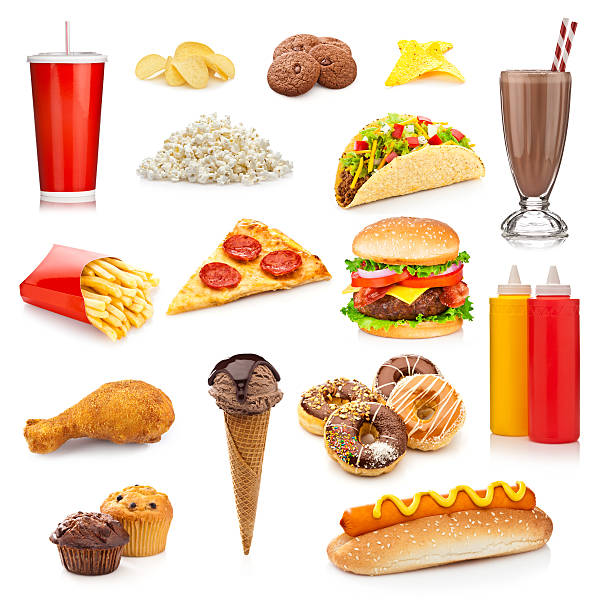 Unhealthy food isolated on white background Large group of unhealthy food isolated on white background. The composition includes, soda, potato chips, cookies, nachos, fries, pizza slice, popcorn, chocolate milkshake, taco, cheeseburger, fried chicken leg, ice cream, donuts, ketchup and mustard, muffins and a hotdog. This is an unhealthy food rich in carbohydrates, sugar and calories. tortilla chip photos stock pictures, royalty-free photos & images