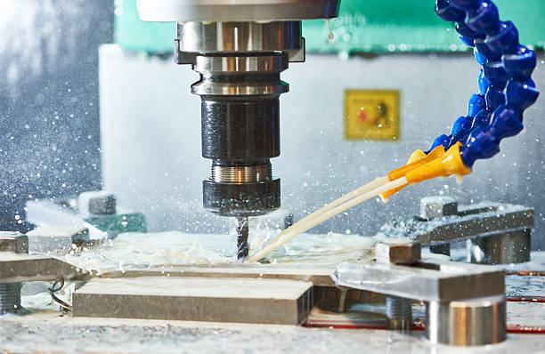 istock Milling metalworking process. Industrial CNC metal machining by vertical mill 598068110