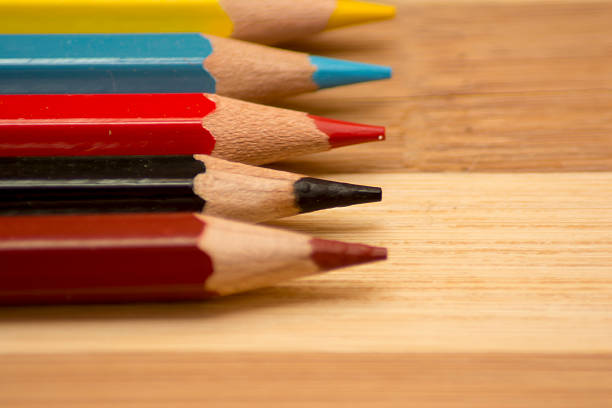 istock Colored pencils on a wooden background 598068924