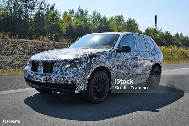 Camouflaged Suv On The Highway Stock Photo - Download Image Now - Car, Wrapping, Design