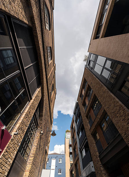 istock Low angle view of apartment building against sky 598070360