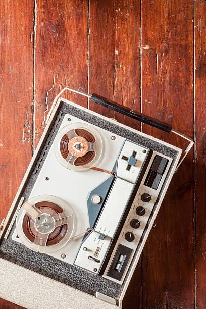 istock Old tape recorder on wooden background 598071688