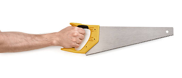 istock Close-up view of man's hand with handsaw, isolated 598074254