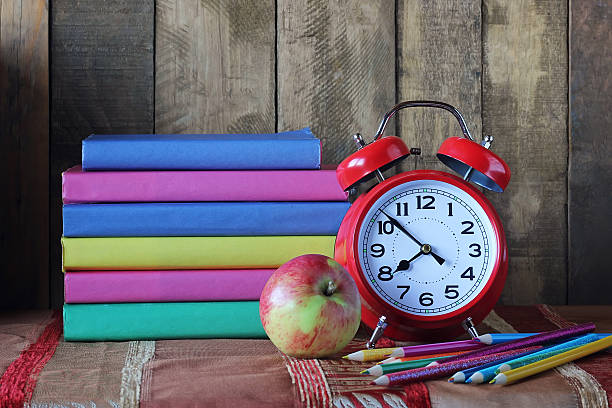 istock Books and an alarm clock. Back to school. September 1. 598075192
