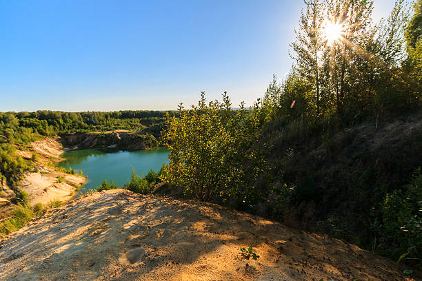 istock quarry or lake or pond with sandy beach 598075266