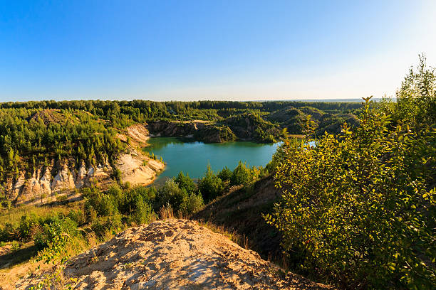 istock quarry or lake or pond with sandy beach 598075340