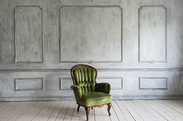 istock One classic armchair against a white wall and floor. Copy 598075738