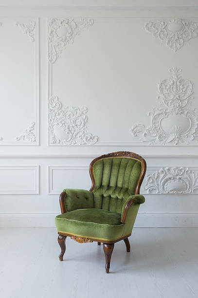 istock One classic armchair against a white wall and floor. Copy 598075902