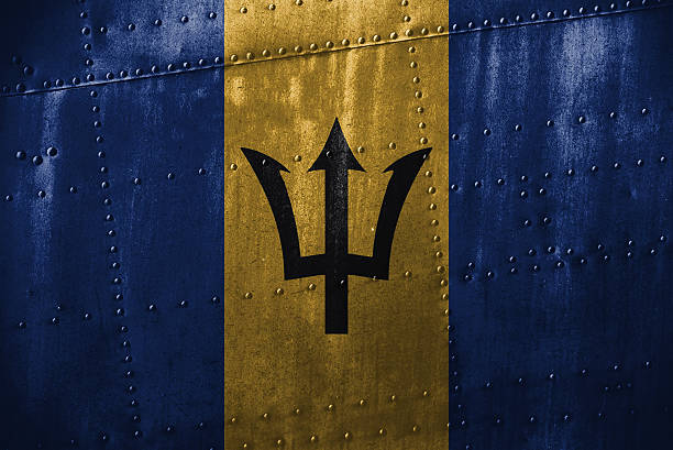 istock metal texutre or background with Barbados flag 598077360