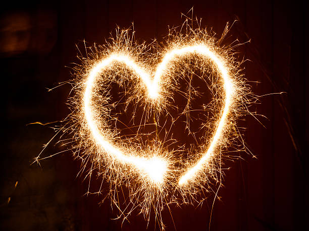 istock Heart symbol painted with sparkler's light 598077734