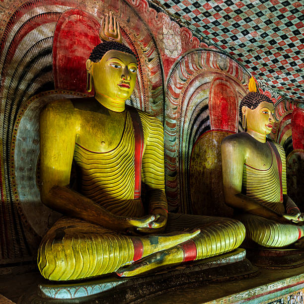 Buddha statue inside Dambulla cave temple, Sri Lanka Buddha statue inside Dambulla cave temple, Sri Lanka. Dambulla cave temple also known as the Golden Temple of Dambulla is a World  Heritage Site in Sri Lanka, situated in the central part of the country. This site is situated 148 km east of Colombo and 72 km  north of Kandy. It is the largest and best-preserved cave temple complex in Sri Lanka. This temple complex dates back to the first century BCE. There are more than 80 documented caves in  the surrounding area. Major attractions are spread over 5 caves, which contain statues and paintings. These paintings and statues  are related to Lord Buddha and his life. There are total of 153 Buddha statues, 3 statues of Sri Lankan kings and 4 statues of  gods and goddesses. dambulla stock pictures, royalty-free photos & images