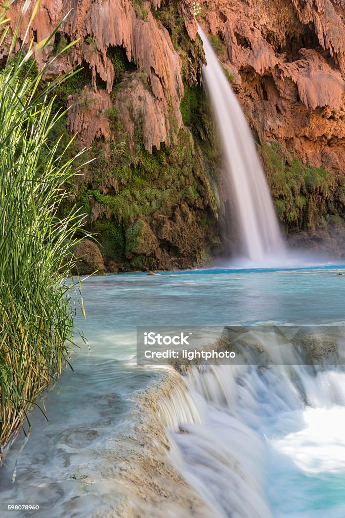 Havasu Falls Travertine Ledge A travertine ledge below Havasu Falls where it plunges into a deep blue-green pool on the Havasupai Indian Reservation in the Grand Canyon. Arizona Stock Photo