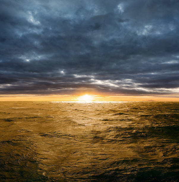 istock Clearing storm over ocean at sunset 598079810