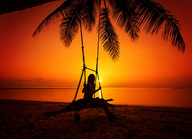 istock Woman at tropical swing 598081928