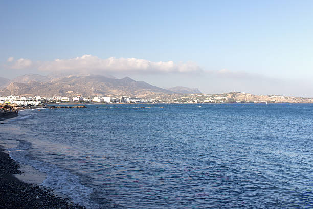 istock City by the sea surrounded by mountains 598082622
