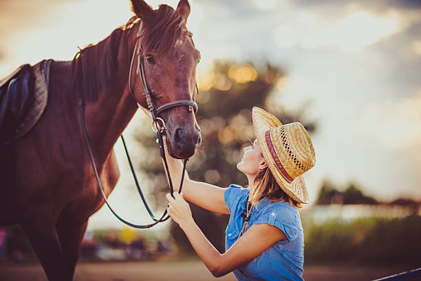 istock Young beautiful woman with a horse 598082854