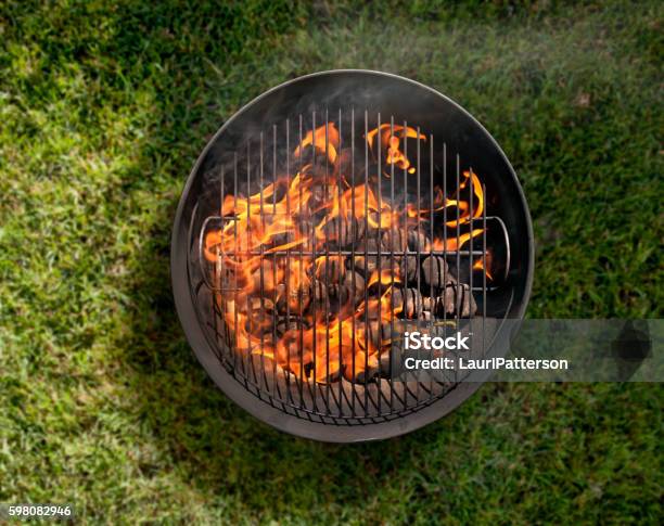 Charcoal Bbq In The Backyard On Grass Stock Photo - Download Image Now - Barbecue Grill, Metal Grate, Barbecue - Meal