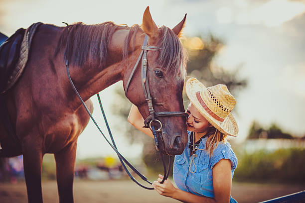 istock Young beautiful woman with a horse 598083032
