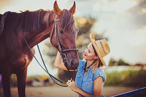 istock Young beautiful woman with a horse 598083096