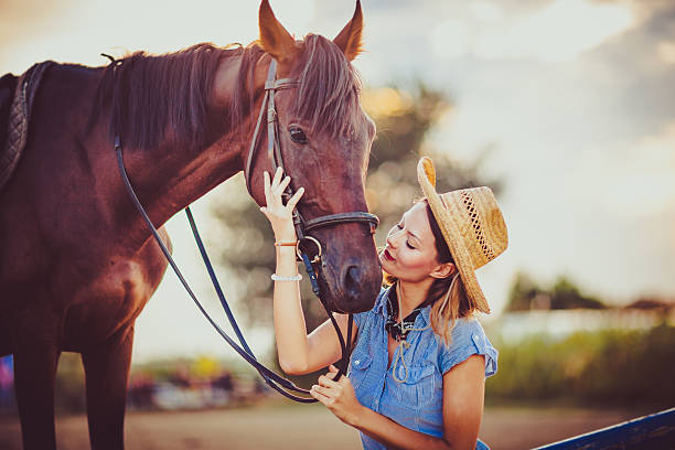 istock Young beautiful woman with a horse 598083136