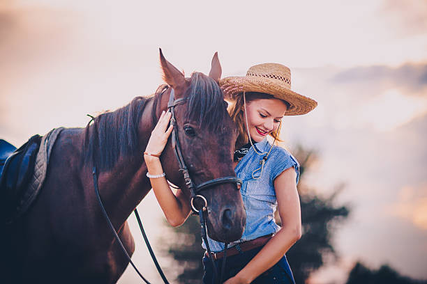 istock Young beautiful woman with a horse 598083174