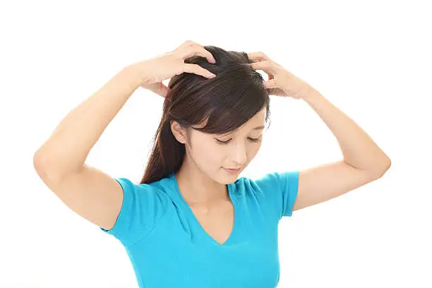 The woman who is doing head massage