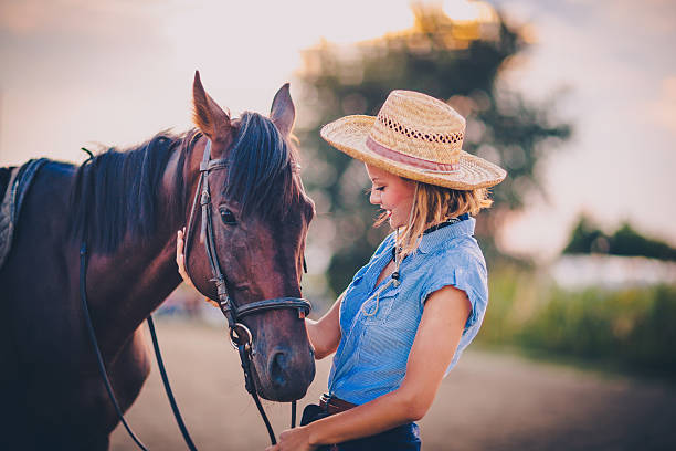 istock Young beautiful woman with a horse 598083222