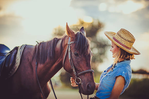 istock Young beautiful woman with a horse 598083272