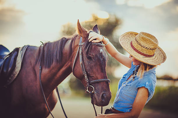 istock Young beautiful woman with a horse 598083324