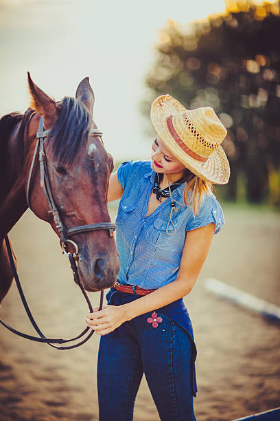 istock Young rider with cowboy hat and horse 598083400
