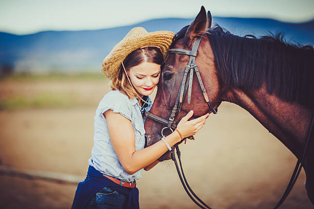 istock Young rider with cowboy hat and horse 598083768