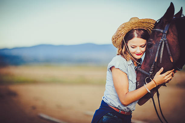 istock Young rider with cowboy hat and horse 598083826