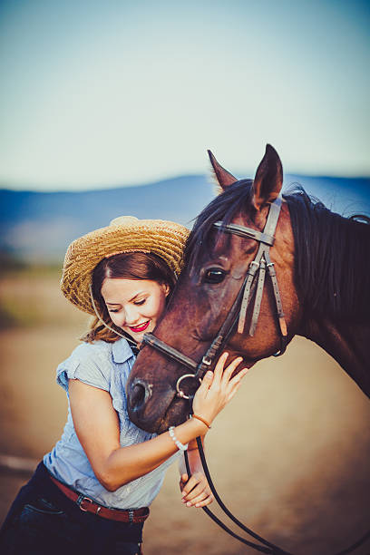 istock Young rider with cowboy hat and horse 598083874