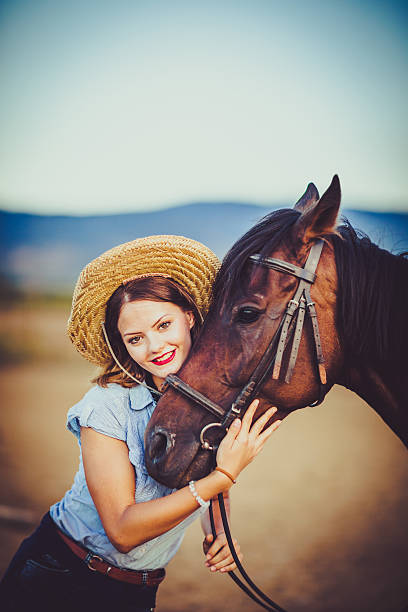 istock Young rider with cowboy hat and horse 598083922