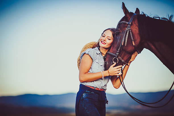 istock Young rider with cowboy hat and horse 598084002