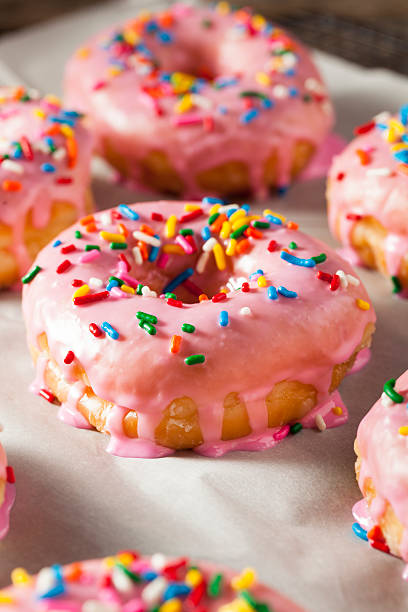 istock Homemade Sweet Donuts with Pink Frosting 598085452