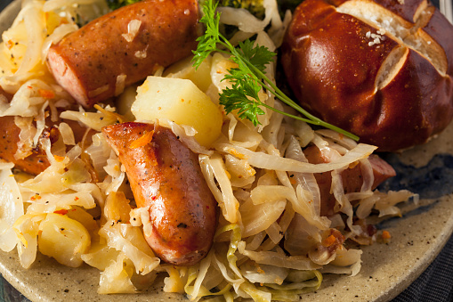 Homemade German Sausage and Sauerkraut with a Pretzel Roll