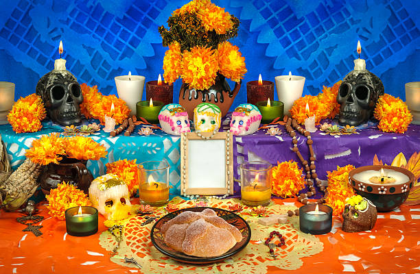 Mexican day of the dead altar (Dia de Muertos) Traditional mexican Day of the dead altar with sugar skulls and candles altar stock pictures, royalty-free photos & images