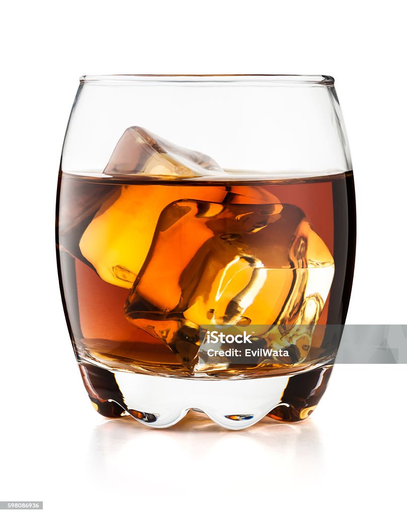 Glass of whiskey isolated on white background Glass of whiskey on the rocks isolated on white background and with clipping path Alcohol - Drink Stock Photo