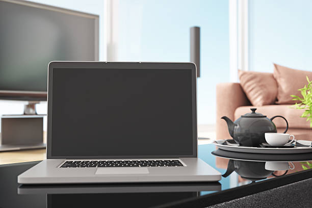 istock Open Laptop On Coffee Table In The Hotel Room 598087170