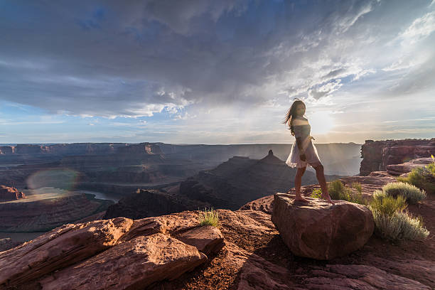 istock Asian bride posing over vast canyons of Utah desert, Moab. 598088026
