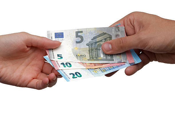 istock Hand giving Euro banknotes to another hand 598090226