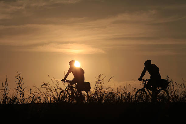 istock Riding a bike in sunset 598090732