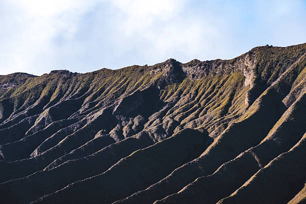 istock Mount Bromo volcano, geological layers with blue sky 598091482