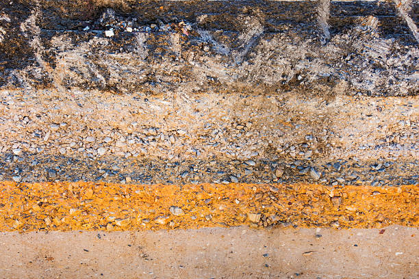 istock Layers soil and rock of traffic road, Layer soil paving. 598091746