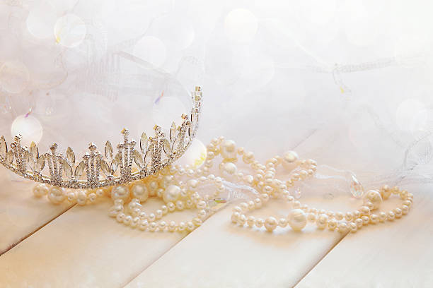 istock White pearls necklace and diamond tiara 598092200