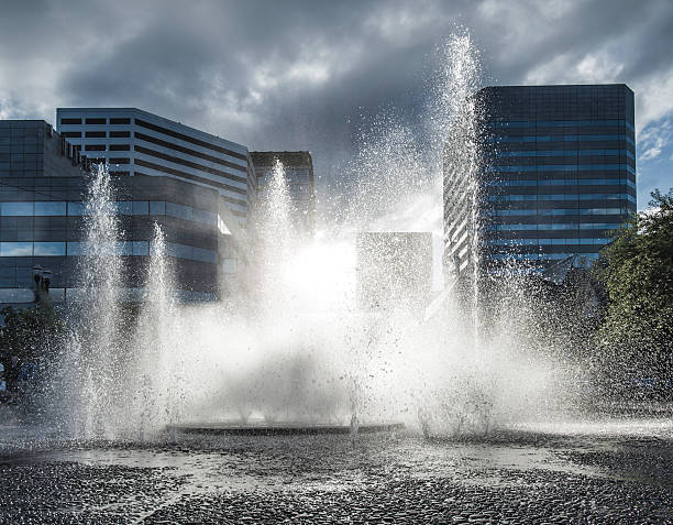 istock Urban Canyon at Dusk, Cobble Paving Water Display, Grunge Lighting 598092594