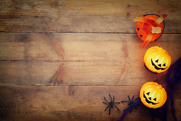 istock Halloween holiday concept top view. Pumpkins, spiders 598092936