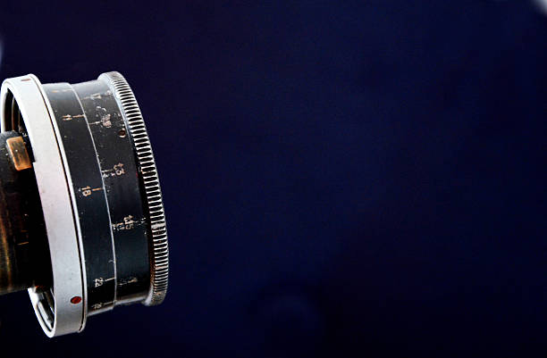 istock Vintage camera lens close-up isolated on black 598094656