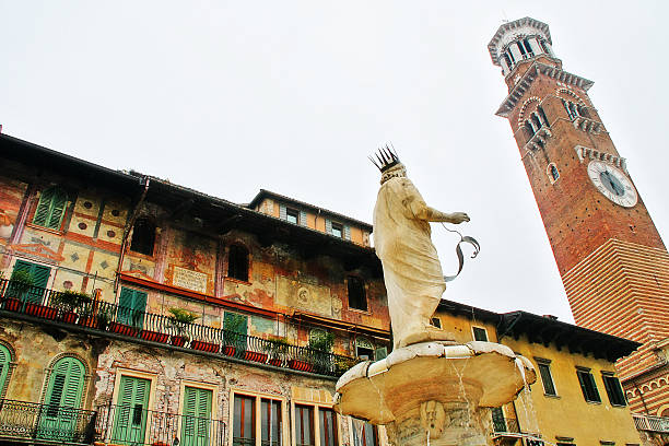 Verona, Italy - July 13, 2015: Detail of Madonna Verona fountain statue with Maffei Palace in the background.